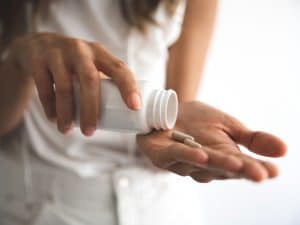 Image of someone holding supplements